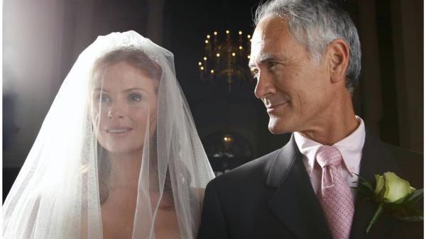 stock image of a father and bride. A stock image of a father and bride. The bride explained she did not want people who were not in traditional relationships at her wedding.